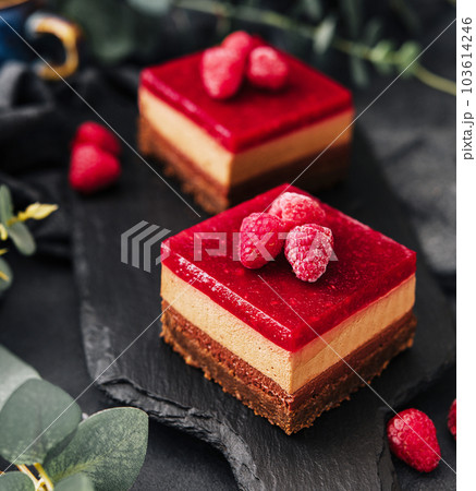 Delicious chocolate mousse cake with raspberries jelly Delicious chocolate mousse cake with raspberries jelly 103614246