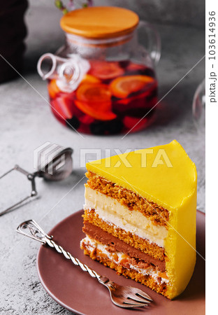 Tasty mango mousse cake on plate 103614936