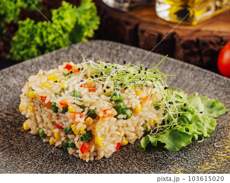 Bowl of rice with peas, corn and red peppers Bowl of rice with peas, corn and red peppers 103615020
