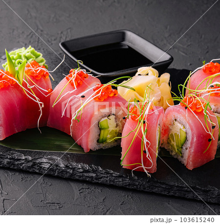 sushi rolls of red tuna on black stone 103615240