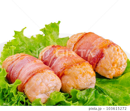 Pork cutlets wrapped in bacon on white Pork cutlets wrapped in bacon on white 103615272