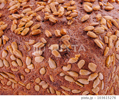 rye bread with sunflower seeds on a white 103615276