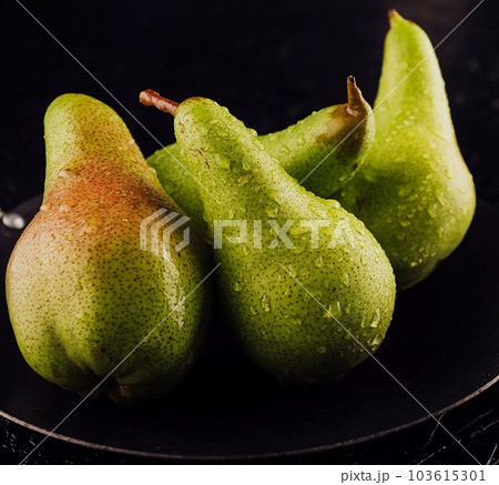 Fresh ripe organic yellow pears with water drops Fresh ripe organic yellow pears with water drops 103615301