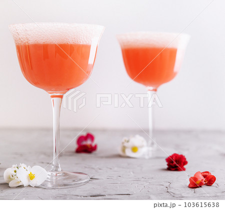 Mimosa alcohol cocktail with orange juice and dry champagne Mimosa alcohol cocktail with orange juice and dry champagne 103615638