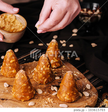 caramel cookies with walnuts on wooden board 103615703