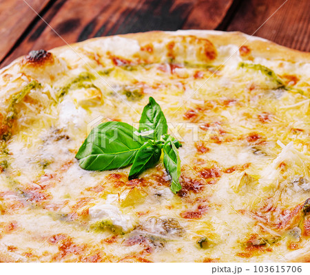 Tasty pizza with pesto sauce on wooden background 103615706