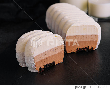 three chocolate mousse cakes with milk three chocolate mousse cakes with milk 103615907
