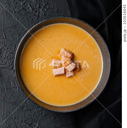 cheese soup with crackers top view 103616045