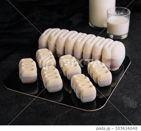 three chocolate mousse cakes with milk 103616048