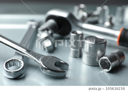 Auto mechanic's tools on metallic surface, closeup Auto mechanic's tools on metallic surface, closeup 103616238