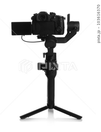 Modern professional video camera isolated on white 103616370