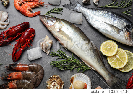 Fresh fish and seafood on grey table, flat lay 103616530