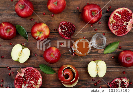 Honey, apples and pomegranate on wooden table, flat lay. Rosh Hashanah holiday 103618199