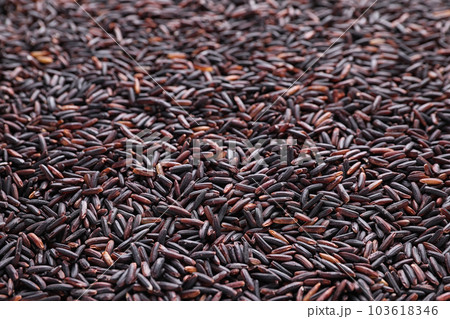 Uncooked organic brown rice as background, closeup Uncooked organic brown rice as background, closeup 103618346