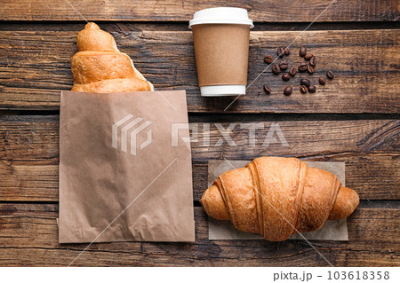 Tasty croissants and coffee on wooden table, flat lay 103618358