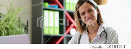 Happy smiling female practitioner posing in clinic office Happy smiling female practitioner posing in clinic office 103619114