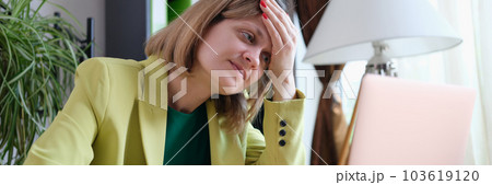 Tired woman working using modern laptop in office 103619120