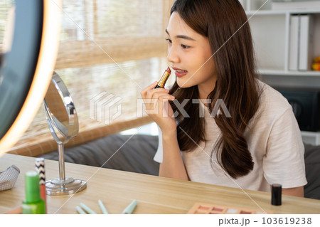 Beautiful women with social media influences are teaching makeup and use cosmetics, In front of the camera to recording vlog video live streaming, Online business on concept of beauty bloggers. 103619238