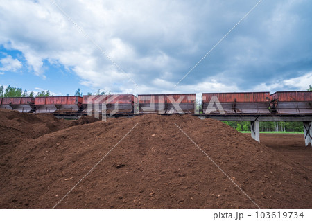 peat transport wagons at the loading point. Raised platform for loading and unloading peat. 103619734