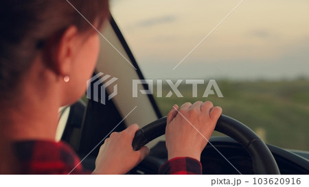 beautiful woman driving car. good mood travel. girl driving car talking and smiling. woman sits front seat car. girl road. driver driving van. holidays nature day off. vacation girlfriend. smile mom 103620916