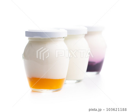 White and fruity yogurt in jar isolated on white background. White and fruity yogurt in jar isolated on white background. 103621188