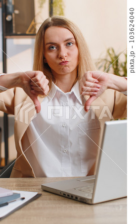 Upset businesswoman show thumbs down, dislike bad work, disapproval dissatisfied feedback at office 103624040
