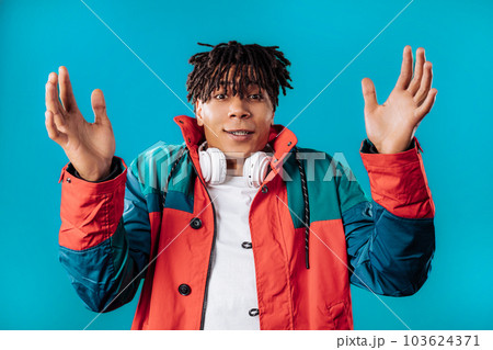 Big large concept.African man showing invisible abstract subject or object sizes Big large concept.African man showing invisible abstract subject or object sizes 103624371
