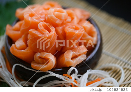 fresh raw salmon fish for cooking food seafood salmon fish, salmon sashimi food salmon fillet japanese menu with shiso perilla leaf lemon herb and spices 103624628