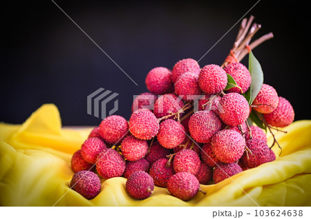 fresh ripe lychee fruit tropical fruit peeled lychees slice in Thailand, lychees on table and black background 103624638