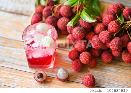 lychees on table, fresh ripe lychee fruit tropical fruit lychee juice drink with sweet soda in glass - lychee smoothie food and drink fruit juice 103624639
