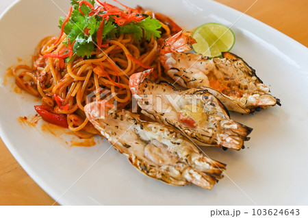noodles plate with spaghetti pasta stir fried with vegetables herb spicy tasty appetizing asian noodles mix seafood stir fried shrimp prawn on white plate noodles plate with spaghetti pasta stir fried with vegetables herb spicy tasty appetizing asian noodles mix seafood stir fried shrimp prawn on white plate 103624643