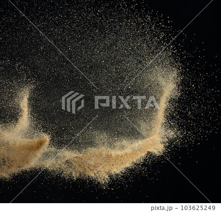 Sand flying explosion, Golden sand wave explode. Abstract sands cloud fly. Yellow colored sand splash throwing in Air. black background Isolated high speed shutter, throwing freeze stop motion 103625249