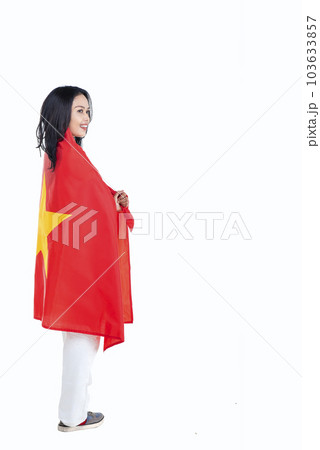 Asian women celebrate Vietnam independence day on 02 September by holding the Vietnam flag 103633857