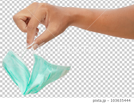 Hand holding medical mask. 103635444
