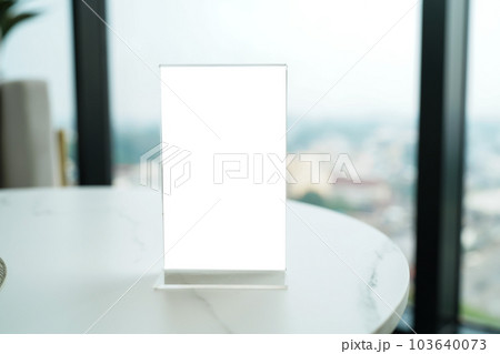 Menu mack up blank for text marketing promotion. Mock up Menu frame standing on wood table in restaurant space for text. 103640073