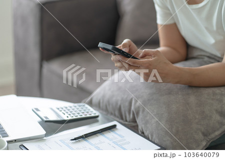 Happy beautiful Asian Woman wearing headphones using laptop at work or enjoying music 103640079