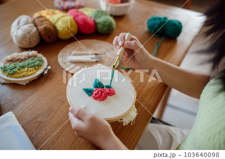Punch needle. Asian Woman making handmade Hobby knitting in studio workshop. designer workplace Handmade craft project DIY embroidery concept. Punch needle. Asian Woman making handmade Hobby knitting in studio workshop. designer workplace Handmade craft project DIY embroidery concept. 103640098