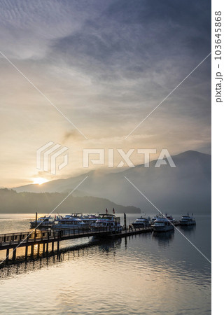 Sunrise view of yacht Marina in Sun Moon Lake, Nantou, Taiwan. it's a famous attraction in Taiwan. Sunrise view of yacht Marina in Sun Moon Lake, Nantou, Taiwan. it's a famous attraction in Taiwan. 103645868