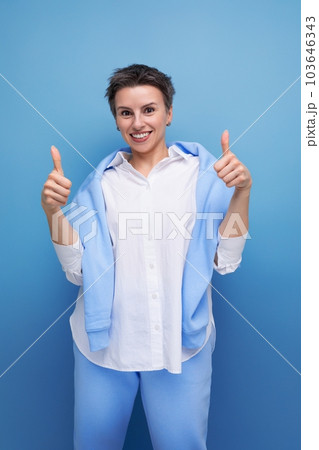 portrait of positive positive young millennial woman showing confidence 103646343