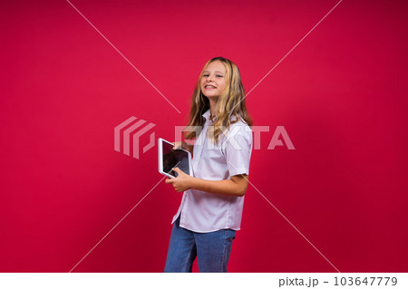 Little happy blonde kid girl 12-13 years laptop pc computer. Children lifestyle childhood concept. Little happy blonde kid girl 12-13 years laptop pc computer. Children lifestyle childhood concept. 103647779