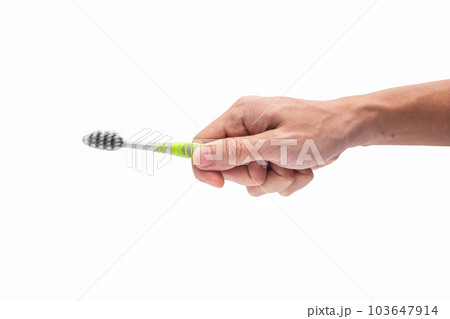 Adult Man Holding Old Tooth Brush on iSolated White Background 103647914