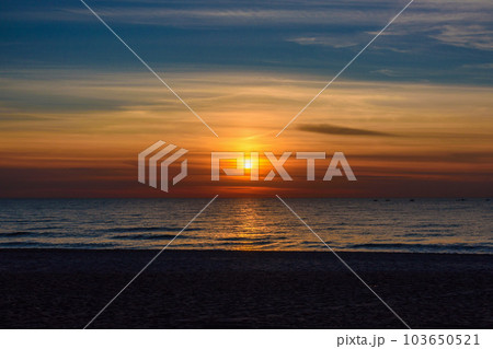 Spectacular bright golden sunset over Baltic sea Spectacular bright golden sunset over Baltic sea 103650521