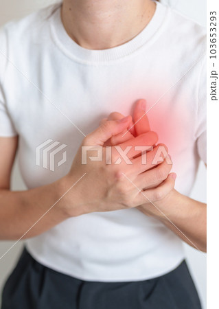 Woman hand holding chest ache. Heart disease, angina disease and symptom heart attack disease Cardiovascular, Atherosclerosis, Hypertensive, Breast Cancer awareness, world Heart day and health concept Woman hand holding chest ache. Heart disease, angina disease and symptom heart attack disease Cardiovascular, Atherosclerosis, Hypertensive, Breast Cancer awareness, world Heart day and health concept 103653293
