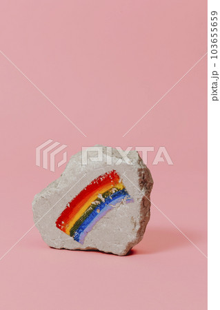 rock with a rainbow flag painted on it rock with a rainbow flag painted on it 103655659