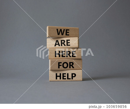 We are here to help symbol. Concept words we are here to help on wooden blocks. Beautiful grey background. Business and we are here to help concept. Copy space. We are here to help symbol. Concept words we are here to help on wooden blocks. Beautiful grey background. Business and we are here to help concept. Copy space. 103659856