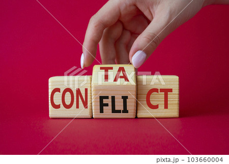 Contact and Conflict symbol. Businessman hand turns wooden cubes with words Contact and Conflict. Beautiful red background. Contact and Conflict and business concept. Copy space 103660004
