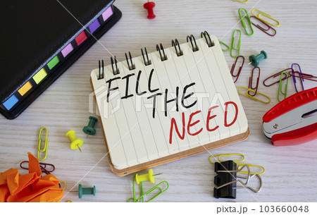 Fill the need symbol. Concept word Fill the need on white notebook. Beautiful wooden background. Business and Fill the need concept. Copy space 103660048