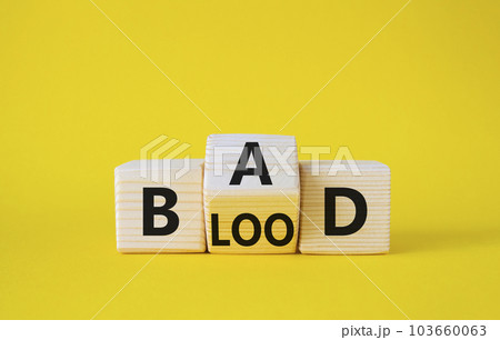 Breed Bad Blood symbol. Wooden cubes with words Breed Bad Blood. Beautiful yellow background. Breed Bad Blood and business concept. Copy space 103660063
