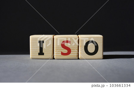 ISO standards quality control symbol. Concept word ISO on wooden cubes. Beautiful grey background. Business and ISO concept. Copy space. 103661334