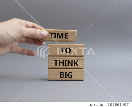 Time to think big symbol. Wooden blocks with words Time to think big. Beautiful grey background. Businessman hand. Business and Time to think big concept. Copy space. Time to think big symbol. Wooden blocks with words Time to think big. Beautiful grey background. Businessman hand. Business and Time to think big concept. Copy space. 103661407